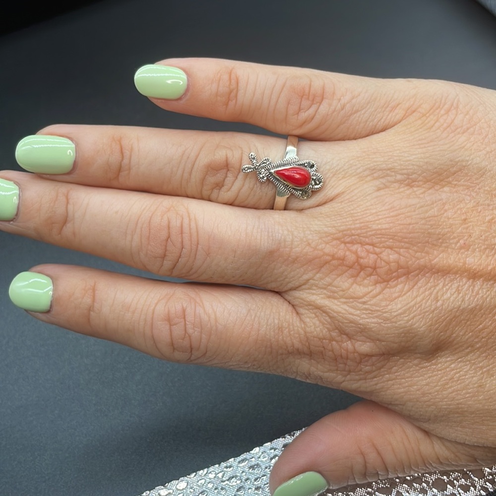 Silver ring with a red center